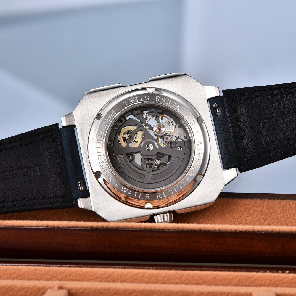 Kelra Square Tourbillon 38MM skeleton automatic watch laying flat, detailed dial view with background visible